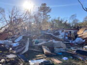 Debris is piled up following severe weather Wednesday, Dec. 14, 2022, in Keithville, La. A volatile storm ripping across the U.S. spawned tornadoes that killed a young boy and his mother in Louisiana, smashed mobile homes and chicken houses in Mississippi and threatened neighboring Southern states with more punishing weather Wednesday.