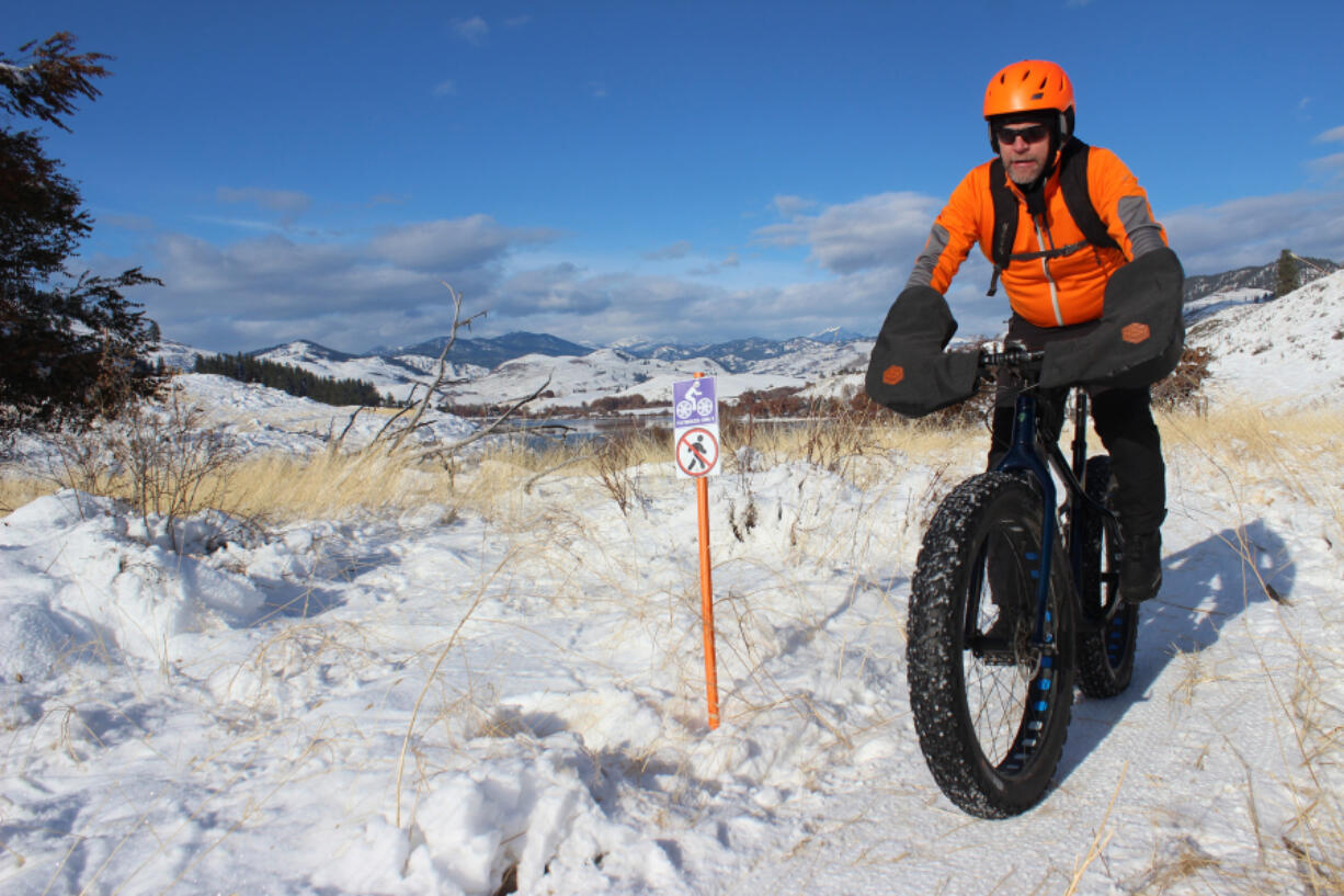 Methow Fatbike's Dave Acheson describes fat biking as like riding "a big, slow mountain bike" as he cruises down a dedicated fat bike trail in Pearrygin Lake State Park outside Winthrop.