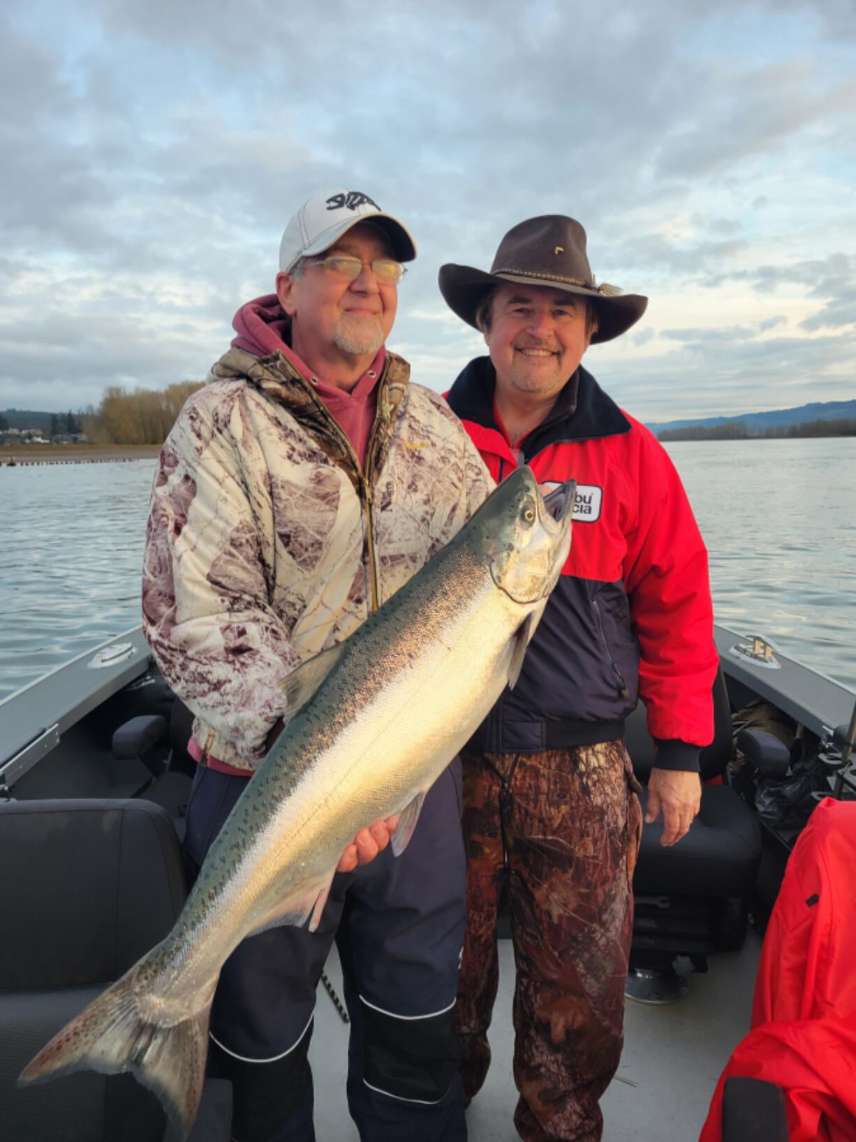 Outdoor writer Bill Herzog (left) and Buzz Ramsey pose with a 2022 Columbia River spring Chinook. The states have released projections for the 2023 return of Spring Chinook, and they offer anglers optimism for the coming year.