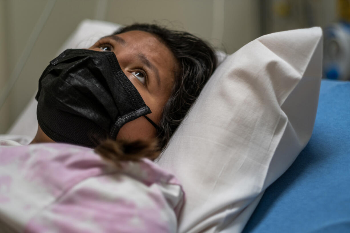 Merlina Segeda Rendon in the emergency department at Loma Linda University Children???s Hospital. The 12-year-old, who has leukemia, had tested positive for the coronavirus on a rapid test at home. At times, the preteen translated questions into Spanish for her mother.