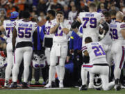 Buffalo Bills players react after teammate Damar Hamlin (3) was injured against the Cincinnati Bengals during the first quarter at Paycor Stadium on January 02, 2023, in Cincinnati, Ohio.