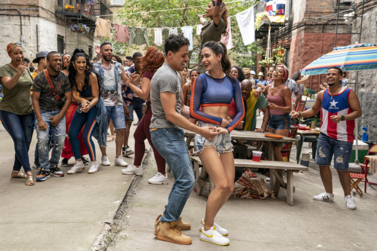 Anthony Ramos, left, and Melissa Barrera star in "In the Heights," based on Lin-Manuel Miranda's hit Broadway musical.