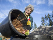 Master Gardener Jackie Trimble, 68, checks on compost in the backyard of her home in Lake Stevens, Washington on Wednesday, Jan. 11, 2023.