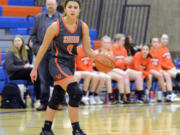 Washougal senior Chloe Johnson (0) sets up the Panthers’ offense during a game against Ridgefield on Tuesday, Jan. 24, 2023, at Ridgefield High School.