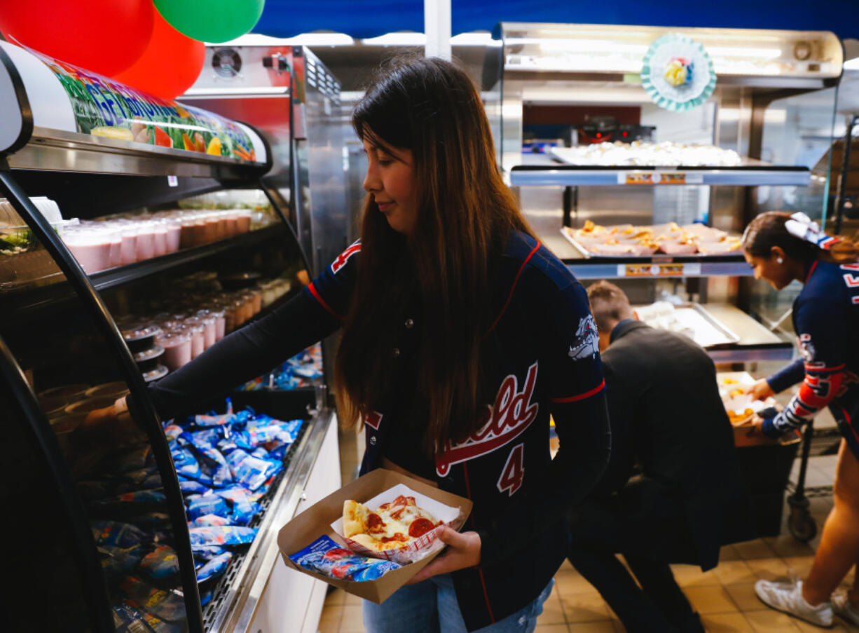 Students select lunch items at Garfield High School on Sept. 23, 2022, in Los Angeles.