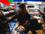 Students select lunch items at Garfield High School on Sept. 23, 2022, in Los Angeles.