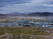 Dust is kicked up from a bulldozer with Las Vegas Boat Harbor recently moved further into the receding Lake Mead at the Lake Mead National Recreation Area on Tuesday, Dec. 27, 2022, in Boulder City. (L.E.