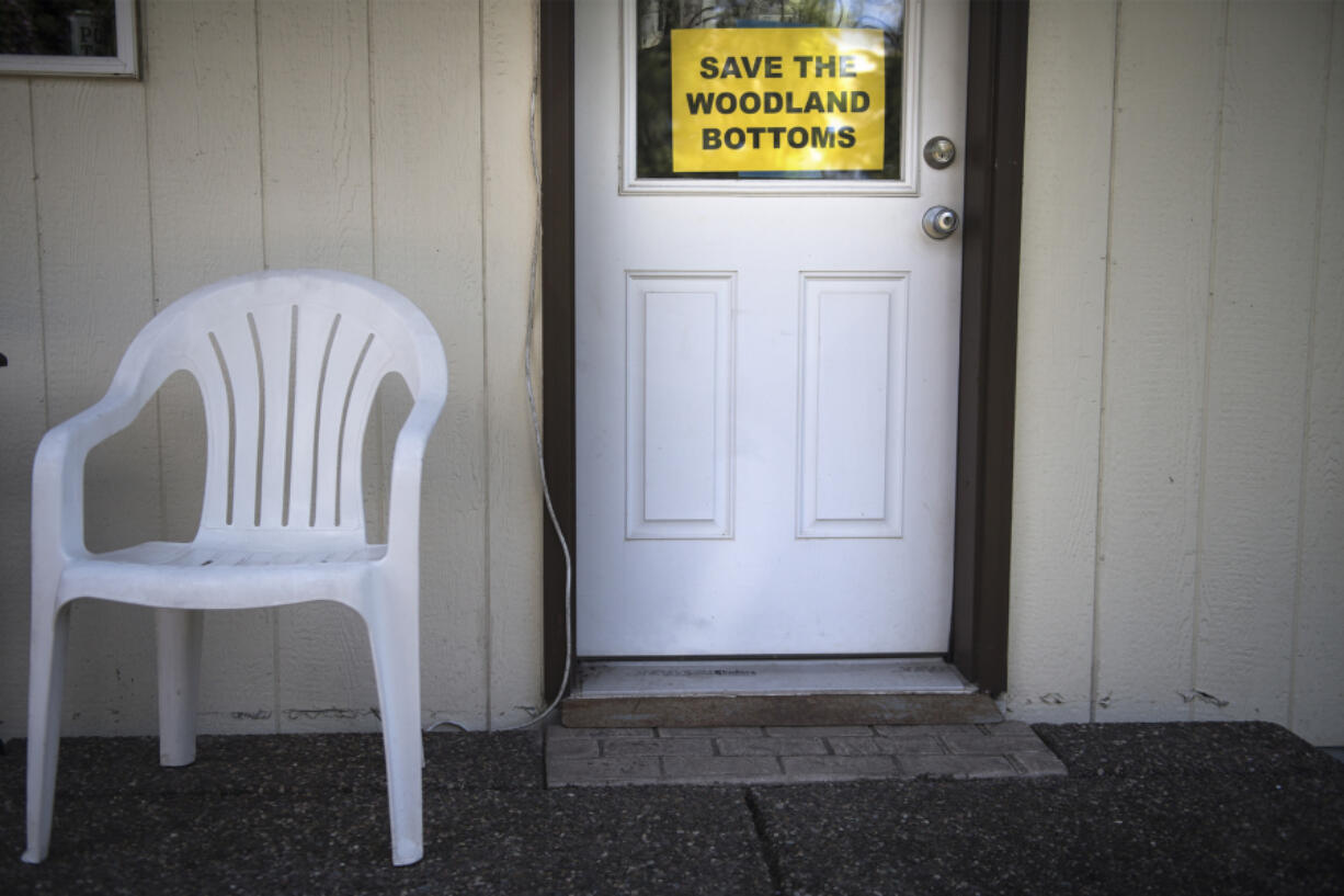 A sign advocating against residential developments in the Woodland Bottoms is seen at a home in 2019.