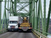 A tight squeeze on the current bridge has cost many vehicles their side-view mirrors.