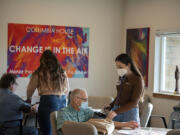 Columbia House resident Jerrol Stanley, from left, has his blood pressure checked by nursing student Olivia Spitzer as fellow resident Billy Davidson also gets checked by nursing student Venetia Prontzos.