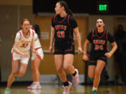 Union's Brooklynn Haywood, center, reacts after making a shot Tuesday, Jan. 3, 2023, during the Papermakers’ 63-52 win against Union at Camas High School.