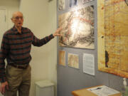 Battle Ground author Don Higgins explains how he found the many documents included in an exhibit about the city's history at the Battle Ground Community Library.