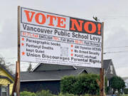 A sign posted by opponents of a replacement levy for Vancouver Public Schools says it was financed by People United for Clark County, a local right-wing political action committee.