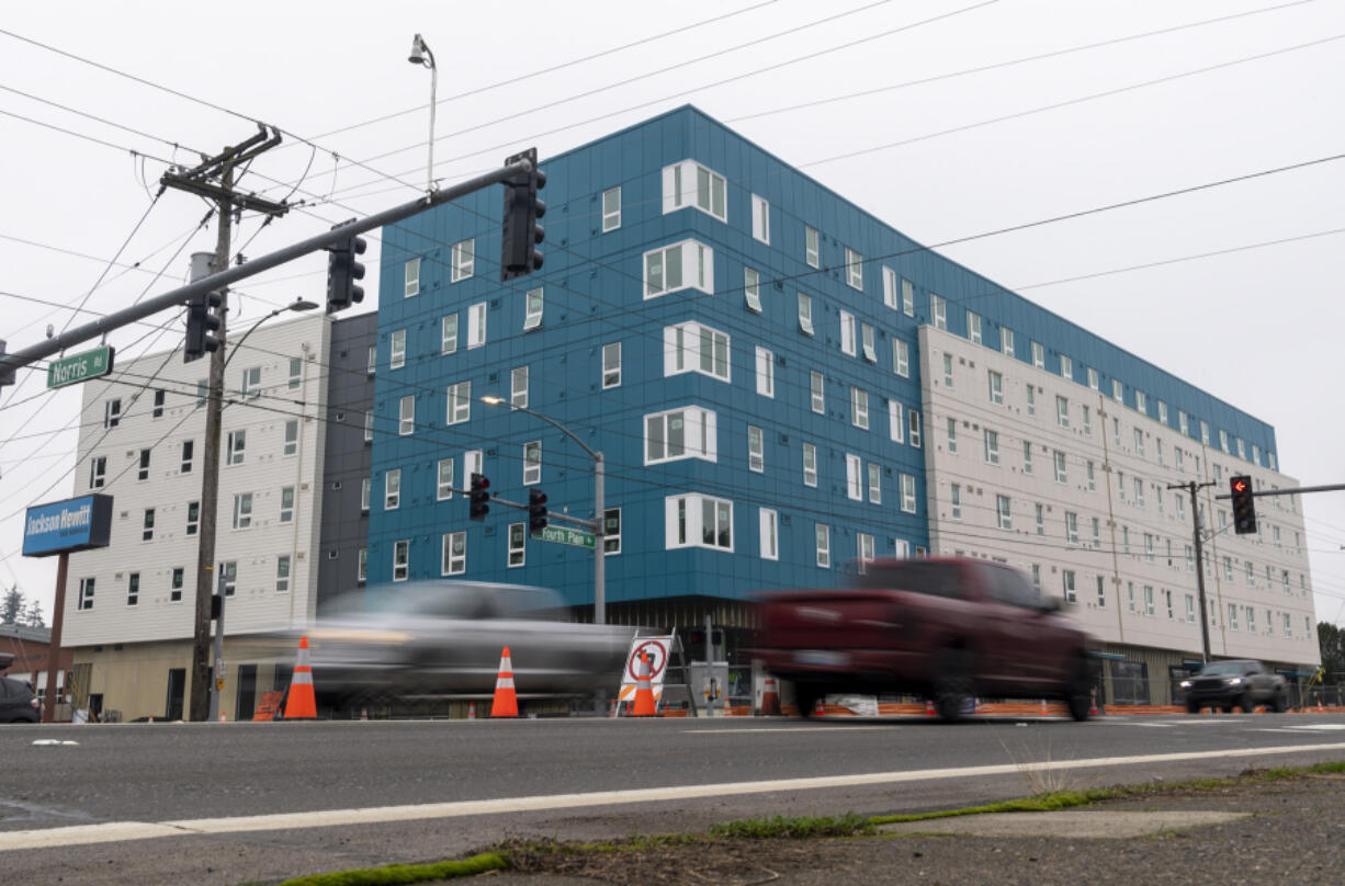 Cars pass by continuing construction on Fourth Plain Community Commons in Vancouver. The mixed-use housing complex has 106 affordable units developed by the Vancouver Housing Authority, using $1.5 million from the city's Affordable Housing Fund.