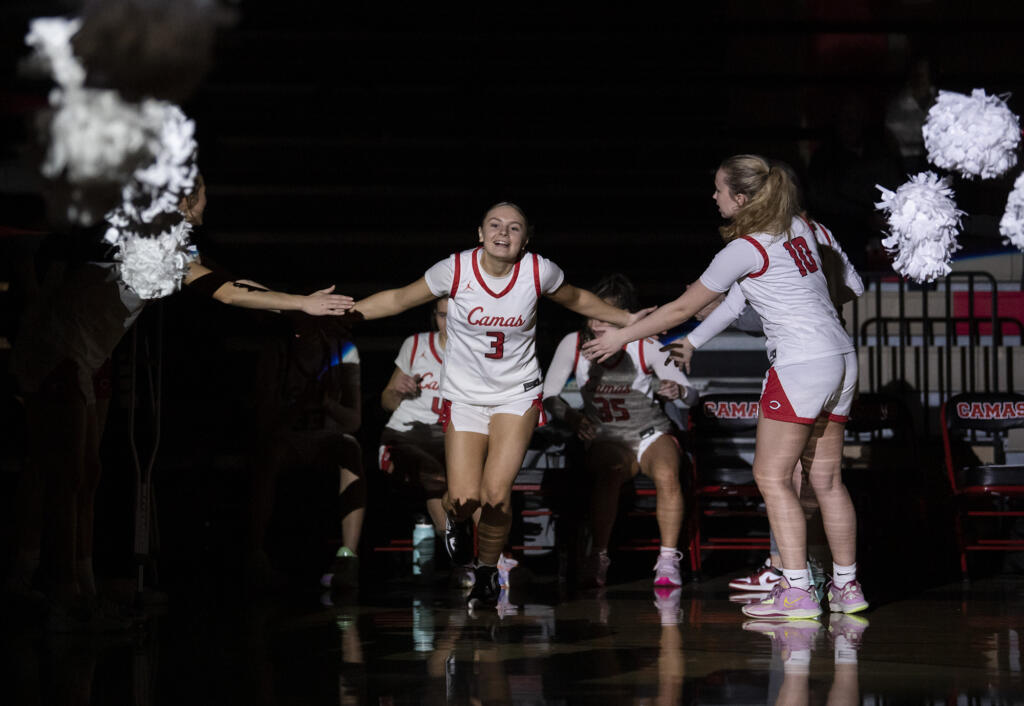 Camas junior Riley Sanz, center, is introduced Tuesday, Jan. 31, 2023, before the Papermakers’ 77-34  win against Skyview at Camas High School.