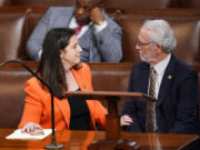 Rep. Elise Stefanik, R-N.Y., talks with Rep. Dan Newhouse, R-Wash., in the House chamber as the House meets for a second day to elect a speaker and convene the 118th Congress in Washington, Wednesday, Jan. 4, 2023.