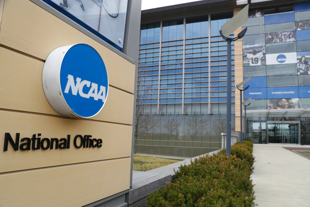 FILE - This is a March 12, 2020, file photo showing NCAA headquarters in Indianapolis. The NCAA and many of its student-athletes are closely watching a court case in Pennsylvania that could determine whether Division I athletes should be paid for their time in the same way students are paid for work-study jobs.