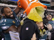 Philadelphia Eagles head coach Nick Sirianni, center, is doused by defensive tackle Fletcher Cox (91) and teammates during the second half of the NFC Championship NFL football game between the Philadelphia Eagles and the San Francisco 49ers on Sunday, Jan. 29, 2023, in Philadelphia.