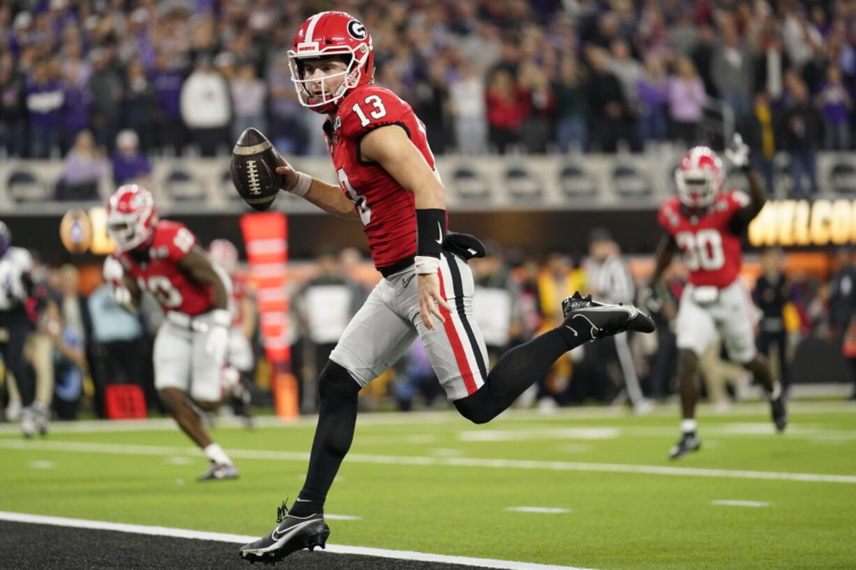 Georgia quarterback Stetson Bennett (13) runs into the end zone against TCU on Monday in Inglewood, Calif.