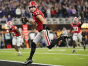 Georgia quarterback Stetson Bennett (13) runs into the end zone against TCU on Monday in Inglewood, Calif.