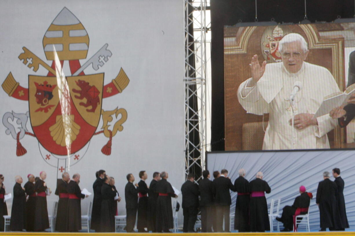 FILE - Bishops watch Pope Benedict XVI on a large video monitor during a rally with young people and seminarians at Saint Joseph's Seminary in Yonkers, N.Y., Saturday, April 19, 2008. Many of the conservative prelates who dominate the U.S. Conference of Catholic Bishops were appointed by Benedict. Even after his death in December 2022, Catholic academics and clergy say his absence is unlikely to weaken the conservatives' collective power or end the culture wars that have divided the USCCB.