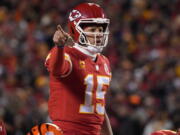 Kansas City Chiefs quarterback Patrick Mahomes signals teammates during the first half of the NFL AFC Championship playoff football game against the Cincinnati Bengals, Sunday, Jan. 29, 2023, in Kansas City, Mo.