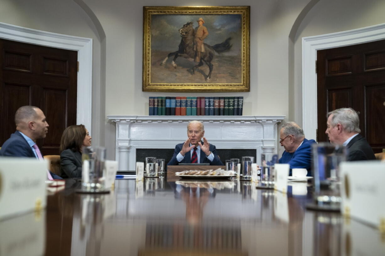 President Joe Biden speaks during a meeting with Democratic lawmakers in the Roosevelt Room of the White House, Tuesday, Jan. 24, 2023, in Washington, including from left, House Minority Leader Hakeem Jeffries of N.Y., Vice President Kamala Harris, Senate Majority Leader Sen.