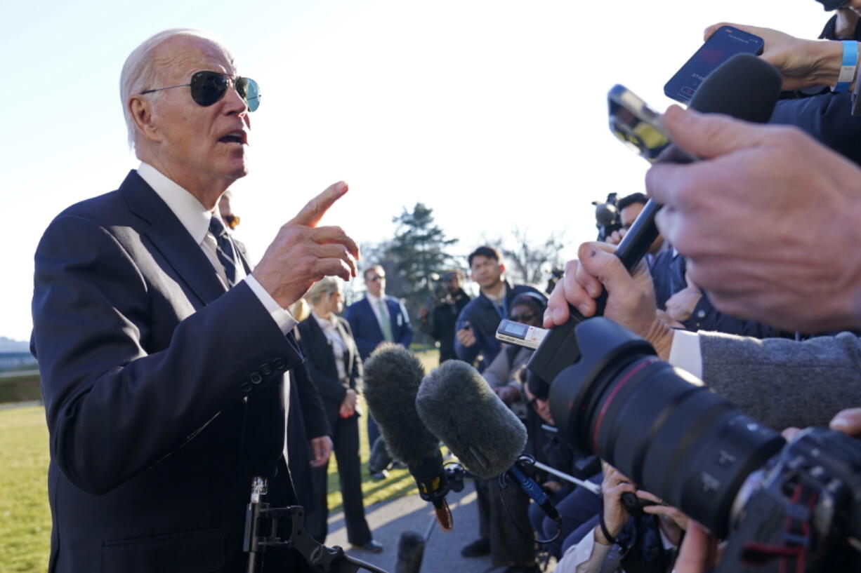 President Joe Biden talks with reporters on the South Lawn of the White House in Washington, Monday, Jan. 30, 2023, after returning from an event in Baltimore on infrastructure.