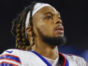 FILE - Buffalo Bills defensive back Damar Hamlin (3) leaves the field after an NFL football game against the New England Patriots, Thursday, Dec. 1, 2022, in Foxborough, Mass. Hamlin was in critical condition early Tuesday, Jan. 3, 2023, after the Bills say his heart stopped following a tackle during the Monday Night Football game, which was indefinitely postponed. (AP Photo/Greg M.