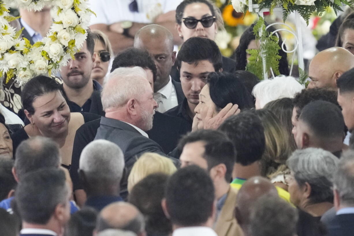 Brazil President Luiz Inacio Lula da Silva, gives condolences to Marcia Aoki, widow of the late Brazilian soccer player Pele, during a wake at Vila Belmiro stadium in Santos, Brazil, Tuesday, Jan. 3, 2023.