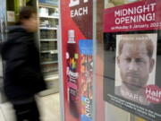 A poster advertises the midnight opening of a store to sell the new book by Prince Harry called 'Spare' in London, Monday, Jan. 9, 2023. Prince Harry has defended his memoir that lays bare rifts inside Britain's royal family. He says in TV interviews broadcast Sunday that he wanted to "own my story" after 38 years of "spin and distortion" by others. Harry's soul-baring new memoir, "Spare," has generated incendiary headlines even before its release.