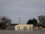 A home sits in floodwaters in Salinas, Calif. on Thursday, Jan. 12, 2023.