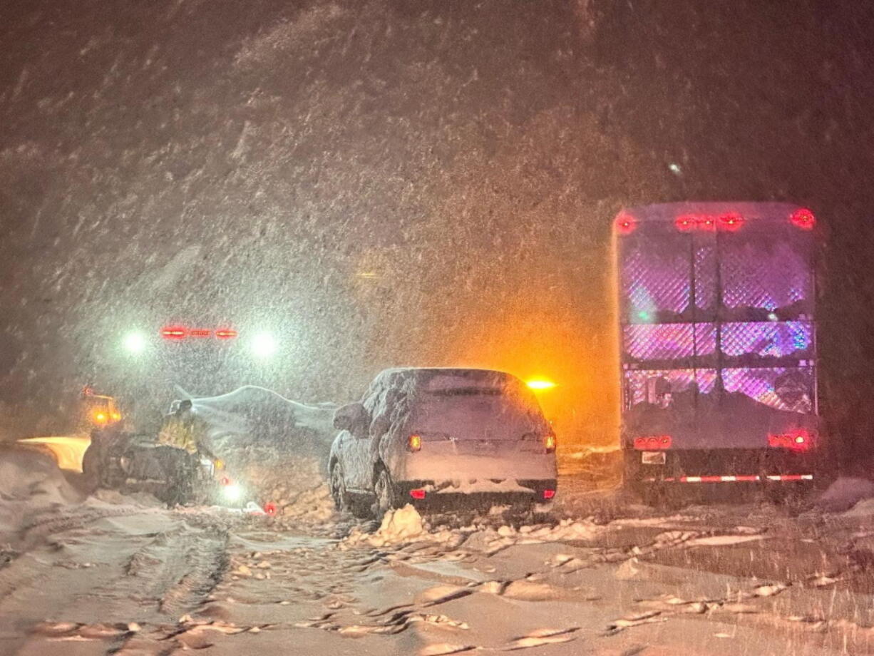 This image taken Saturday, Dec 31, 2022 and released by California Highway Patrol Truckee, vehicles stranded are stranded along Interstate 80 at the Nevada State line and Colfax, Calif. Driving conditions are dangerous and treacherous, travel is not advised. There are dozens and dozens of vehicles stuck on the freeway and county roads, and we are responding to calls as Calif. California was drying out and digging out on New Year's Day after a powerful storm brought drenching rain or heavy snowfall to much of the state, snarling traffic and closing highways.