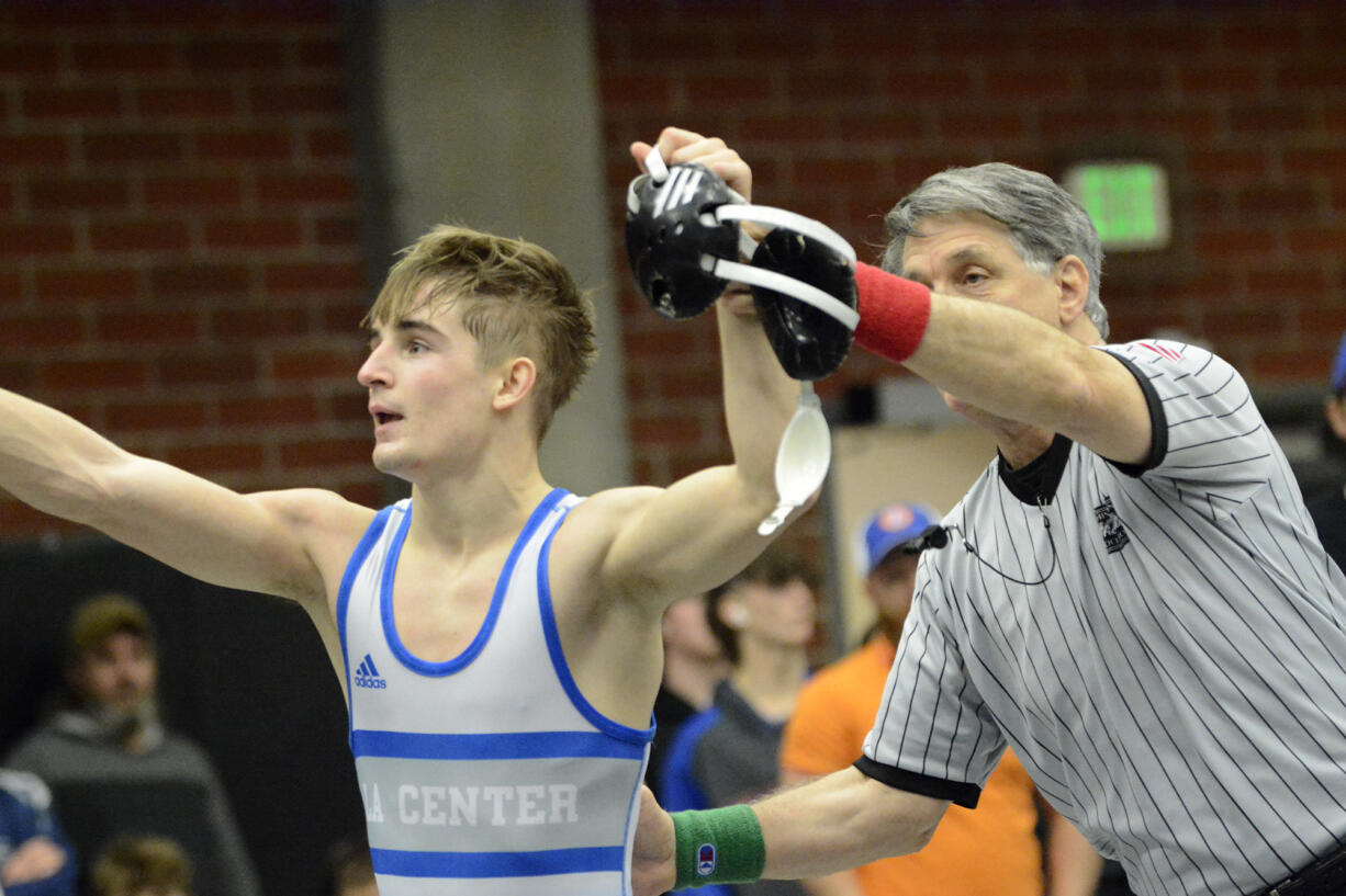 La Center's Malachi Wallway points to the stands after winning the boys 120-pound championship match at the Clark County Wrestling Championships at Union High School on Saturday, Jan.