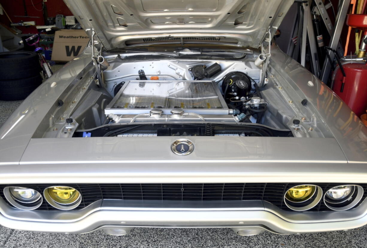 Kevin Erickson's electrified 1972 Plymouth Satellite is seen at his Commerce City, Colo., home on Sept. 20, 2022. Erickson is part of a small but expanding group of tinkerers, racers, engineers, and entrepreneurs across the country converting vintage cars and trucks into greener, often much faster, electric vehicles.