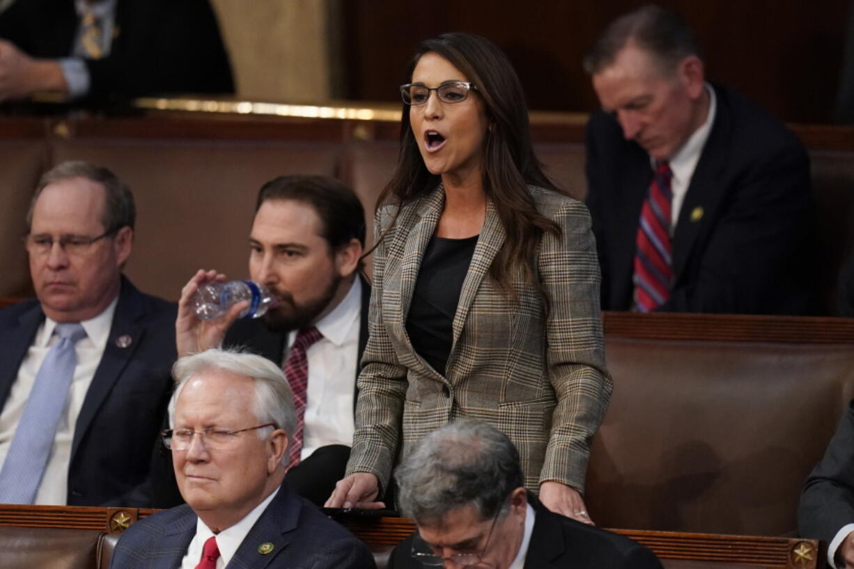 Rep. Lauren Boebert, R-Colo., casts a vote for Rep. Kevin Hern, R-Okla., during the eight round of voting in the House chamber as the House meets for the third day to elect a speaker and convene the 118th Congress in Washington, Thursday, Jan. 5, 2023.