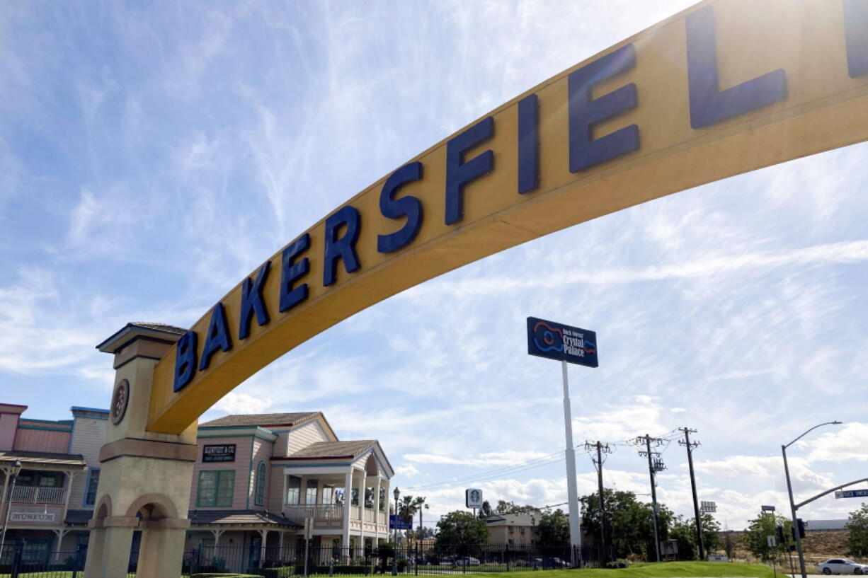 FILE - A sign for Bakersfield, Calif., is displayed over Sillect Avenue at Buck Owens Boulevard on April 20, 2022. Kevin McCarthy is a son of California's Central Valley, a farming and oil-pumping heartland. Some voters are asking if what has become an embarrassing bid to succeed Democratic House Speaker Nancy Pelosi came at the expense of the twin engines of the local economy - oil production and agriculture.