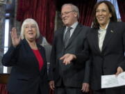 Vice President Kamala Harris gestures Tuesday toward waiting family members as she participates in a ceremonial swearing-in of Sen.