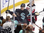 Seattle Krakencenter Ryan Donato (9) celebrates after scoring against the New Jersey Devils during the second period of an NHL hockey game, Thursday, Jan. 19, 2023, in Seattle.