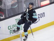 Seattle Kraken left wing Andre Burakovsky celebrates his game overtime goal against the New Jersey Devils in an NHL hockey game, Thursday, Jan. 19, 2023, in Seattle.