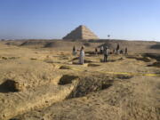 Egyptian antiquities workers dig at the site of the Step Pyramid of Djoser in Saqqara, 24 kilometers (15 miles) southwest of Cairo, Egypt, Thursday, Jan. 26, 2023. Egyptian archaeologist Zahi Hawass, the director of the Egyptian excavation team, announced that the expedition found a group of Old Kingdom tombs dating to the fifth and sixth dynasties of the Old Kingdom, indicating that the site comprised a large cemetery.