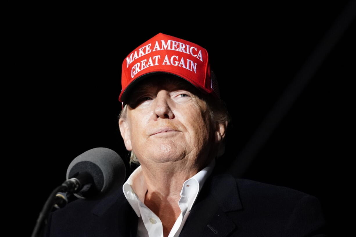 FILE - Former President Donald Trump pauses as he speaks at a rally Jan. 15, 2022, in Florence, Ariz. (AP Photo/Ross D.