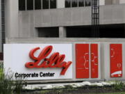 FILE - This April 26, 2017, file photo shows the Eli Lilly & Co. corporate headquarters in Indianapolis.  Eli Lilly shares slipped Friday, Jan. 20, 2023, after regulators said they need to see more data on the company's application for a quick approval of its potential Alzheimer's disease treatment.