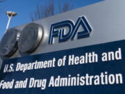 FILE - A sign for the Food and Drug Administration is displayed outside their offices in Silver Spring, Md., on Dec. 10, 2020.  The head of the Food and Drug Administration has announced, Tuesday, Jan. 31, 2023, an overhaul of the agency's food safety and nutrition division. FDA Commissioner Dr. Robert Califf is vowing to better protect consumers and the U.S.