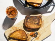 This image released by Milk Street shows a recipe for Kimchi Grilled Cheese with Ham.