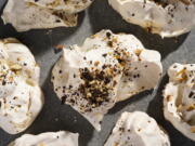 A recipe for meringue cookies topped with salted peanuts and chocolate (Milk Street)