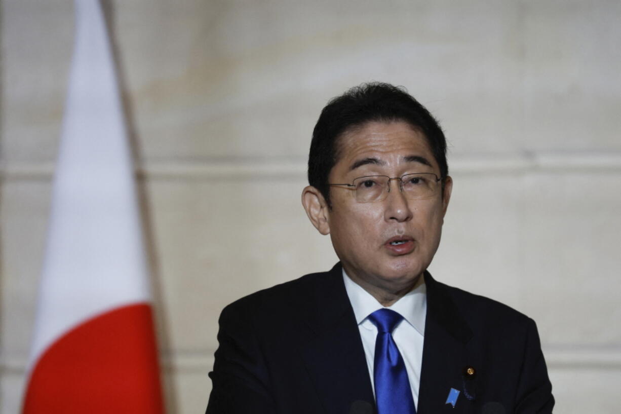 Japan's Prime Minister Fumio Kishida delivers a joint statement with French President Emmanuel Macron at the Elysee Palace in Paris, Monday, Jan. 9, 2023. Japanese Prime Minister Fumio Kishida is starting Monday a weeklong trip to Europe and North America Monday in Paris where he will hold talks with French President Emmanuel Macron on key global issues, including the war in Ukraine.