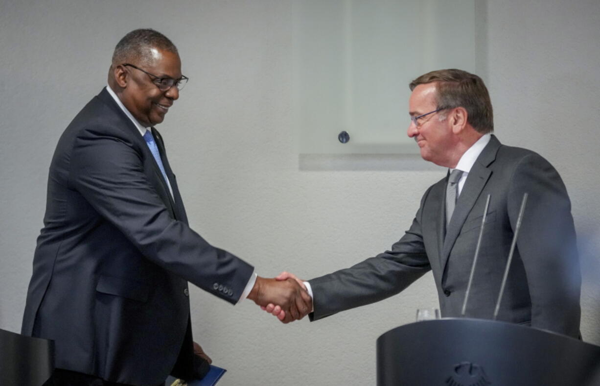 New German Defence Minister Boris Pistorius, right, and US Defense Secretary Lloyd Austin shake hands prior to a meeting at the Defence Ministry in Berlin, Germany, Thursday, Jan. 19, 2023.