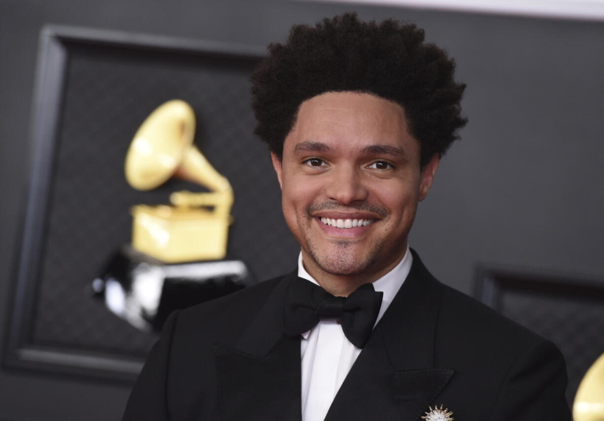 FILE - Trevor Noah appears at the 63rd annual Grammy Awards in Los Angeles on March 14, 2021. Noah is hosting the Grammy Awards for a third-straight year.