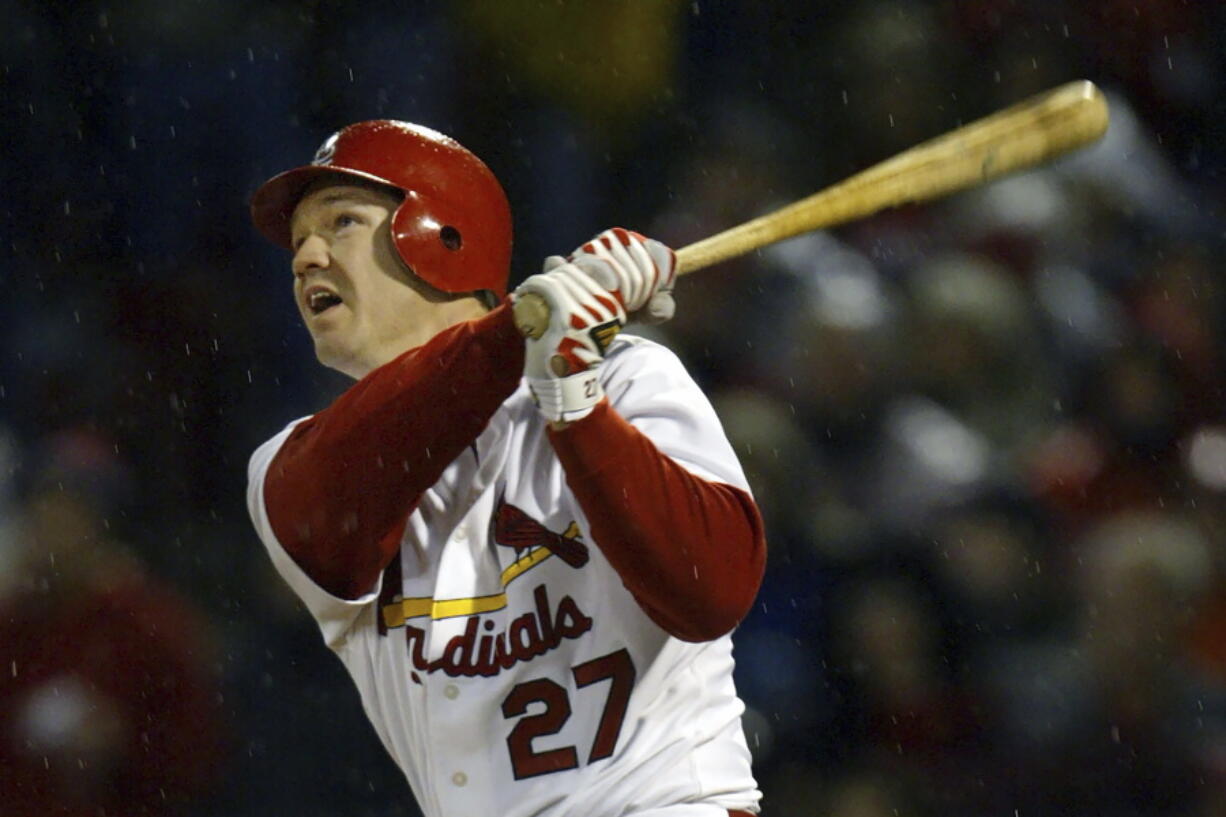 FILE - St. Louis Cardinals Scott Rolen watches his two-run home run off Houston Astros pitcher Chad Harville in the fifth inning during Game 2 of the National League Championship Series at Busch Stadium in St. Louis, Thursday, Oct. 14, 2004. Rolen could become just the 18th third baseman elected to baseball's Hall of Fame, the fewest of any position. Rolen, Todd Helton and Billy Wagner are the leading contenders in the Baseball Writers' Association of America vote announced Tuesday, Jan.